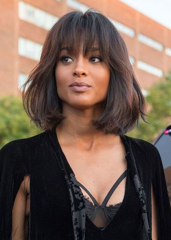A fantastic deep brown long bob with texture and overgrown bangs to make a girlish statement