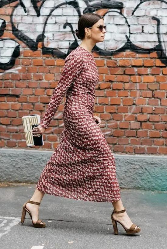 Chic burgundy printed midi dress with long sleeves, high neckline, brown platform shoes, and a whimsy clutch
