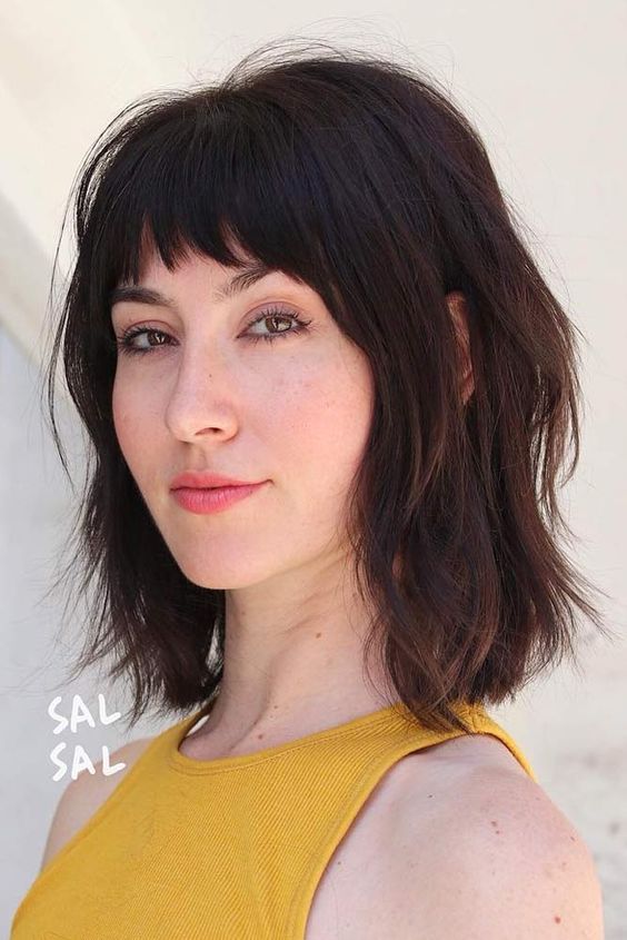 Dark brown long bob with a usual fringe and a shaggy texture, a cool and bright idea, it will make a statement