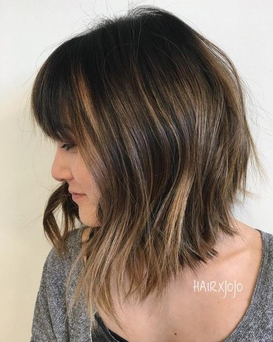 Inverted long brunette bob with caramel highlights and waves, plus a fringe, a chic and stylish idea to try