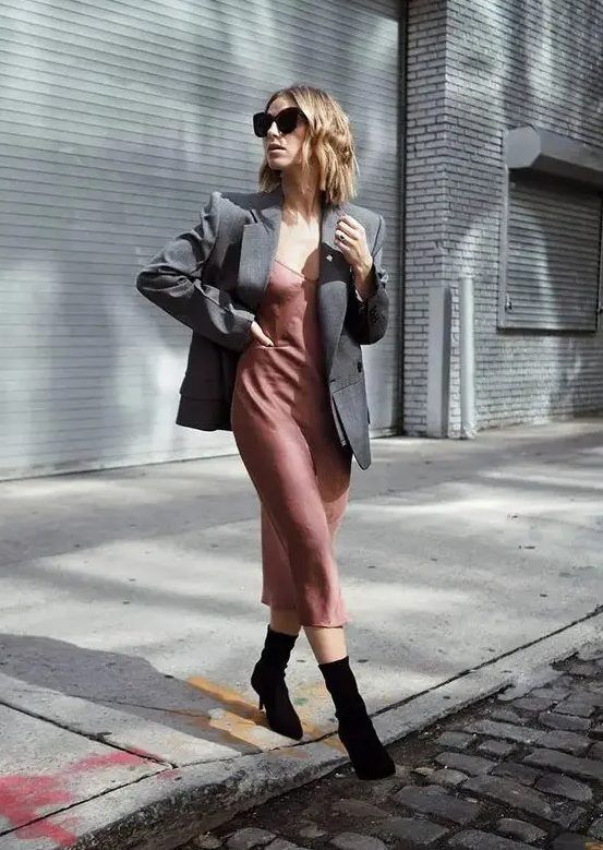 Mauve slip midi dress, grey oversized blazer, black sock boots, a relaxed and minimal guest outfit