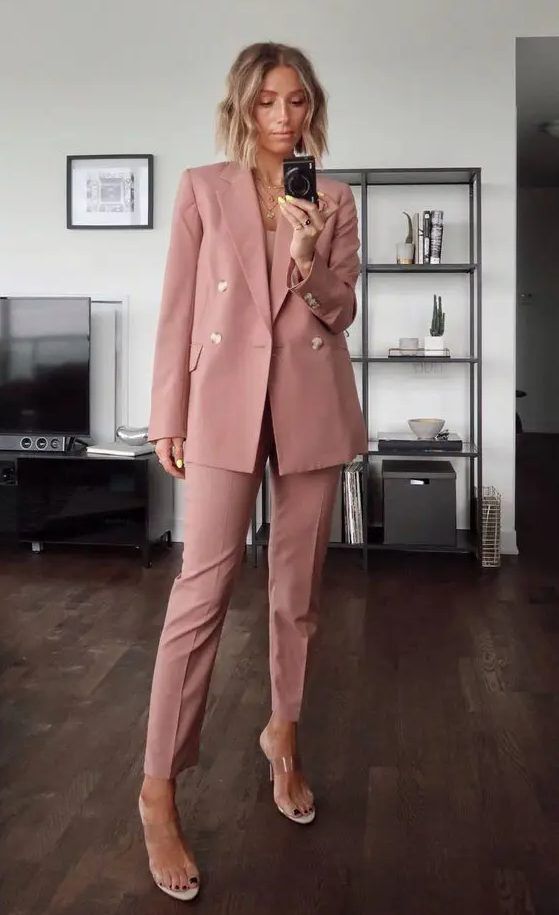 Pink pantsuit, blush top, clear mules, layered necklaces, a gorgeous and stylish outfit for a wedding