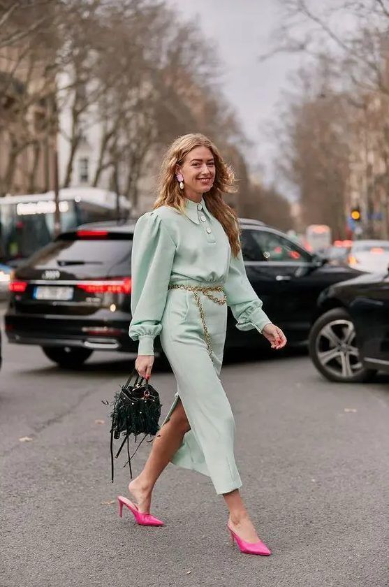 Pretty mint-colored midi shirtdress, hot pink heeled mules, a catchy dark green bag, and a gold chain belt