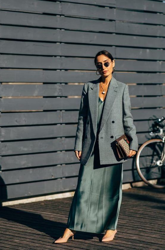 Refined spring look with a green maxi slip dress, a grey oversized blazer, nude shoes, and a printed bag