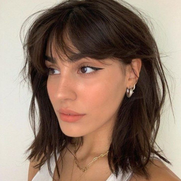 Remove excess weight from thick hair by opting for this It-girl-approved haircut, messy bangs give a messy and effortlessly chic look