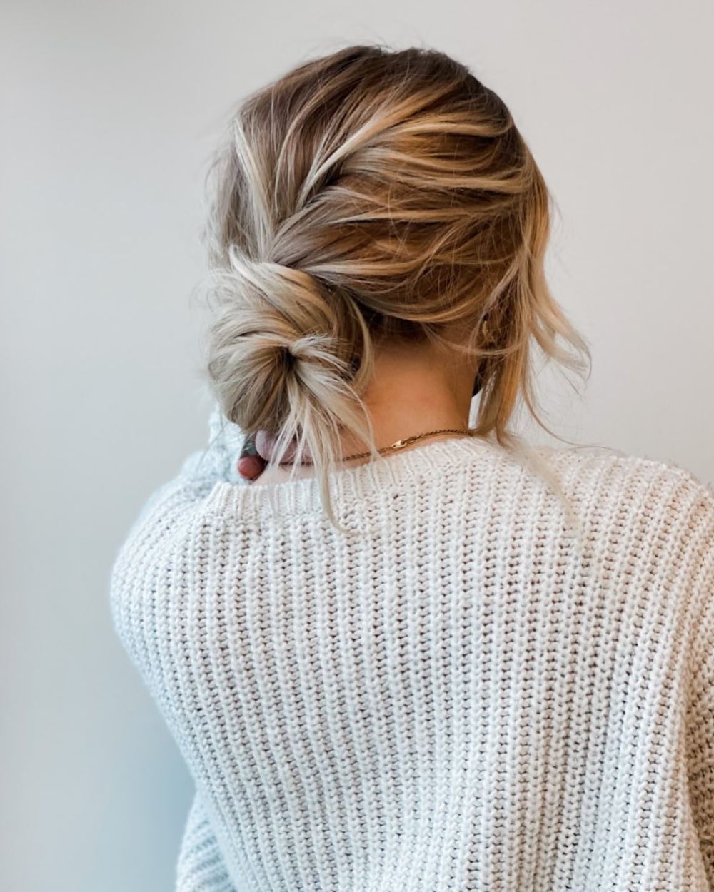 Thanksgiving hairstyles messy blonde low bun